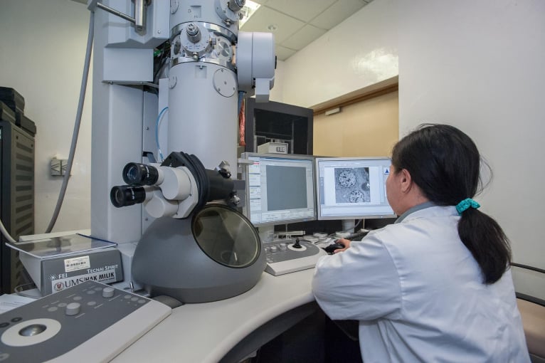 lady sitting at desk at lab